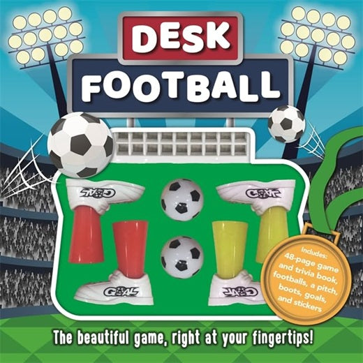 Desk football game set with soccer balls and boots on a stadium background