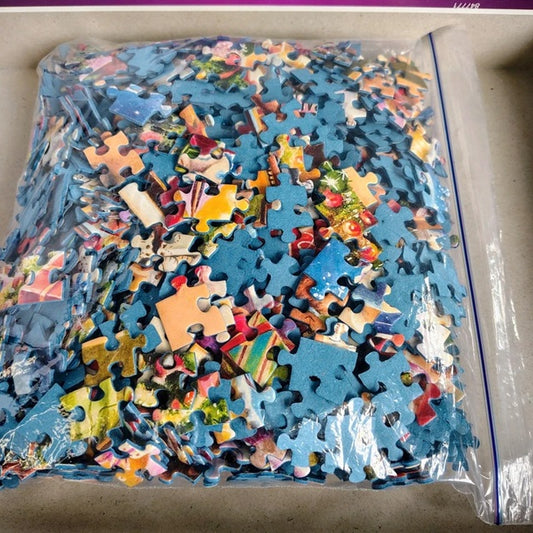 Jigsaw puzzle pieces in a clear bag on a cardboard surface