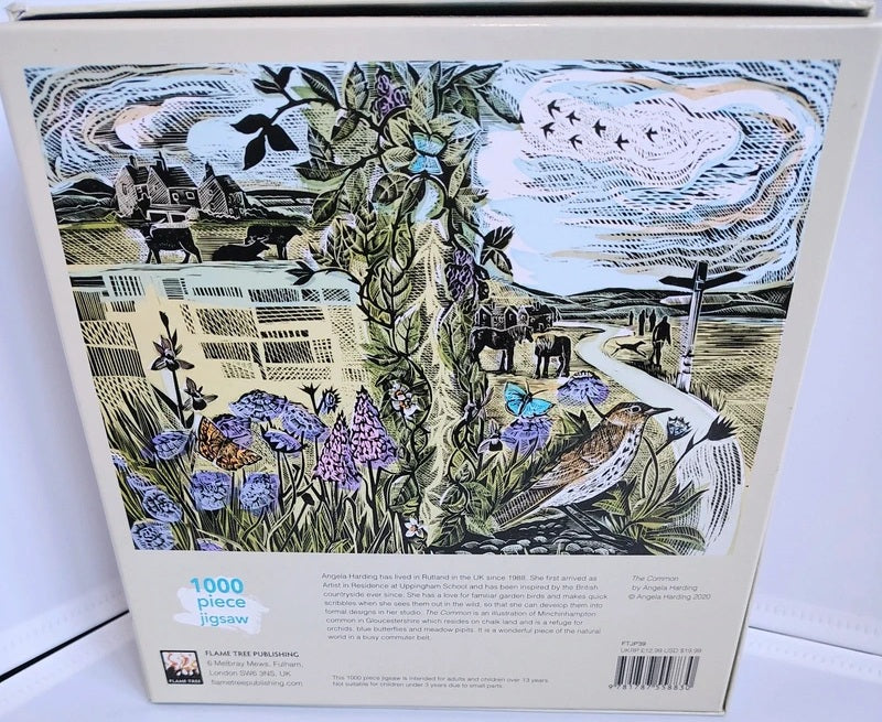 A 1000-piece jigsaw puzzle box by Pocket Two Publishing, featuring a detailed illustration of a rural landscape with cows, a bird, flowers, and a path under a cloudy sky.