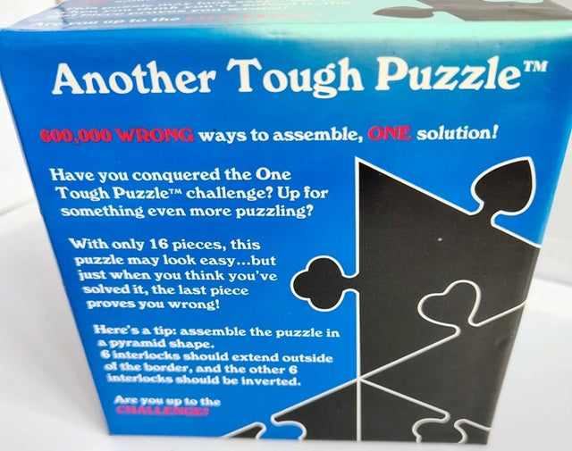 Box of 'Another Tough Puzzle' with blue and white design