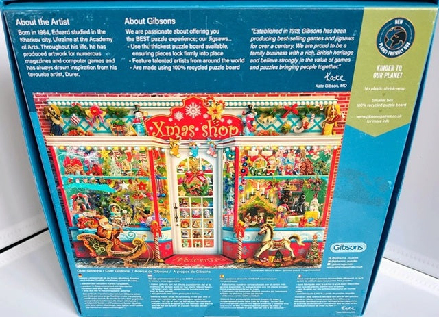 Gibsons Christmas shop puzzle box with colorful illustration and text