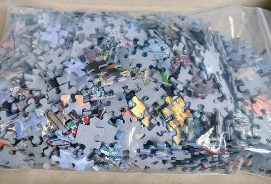 Jigsaw puzzle pieces in a clear plastic bag