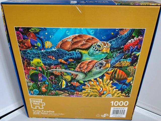 Jigsaw puzzle box with turtle and coral design on a white background