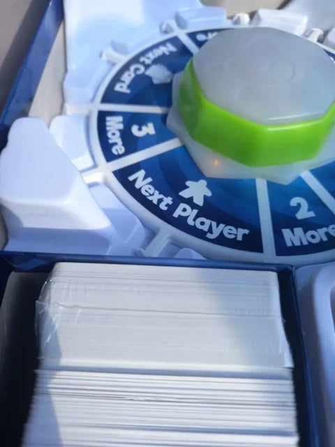 Card game set with spinner and cards, featuring a blue and white design.