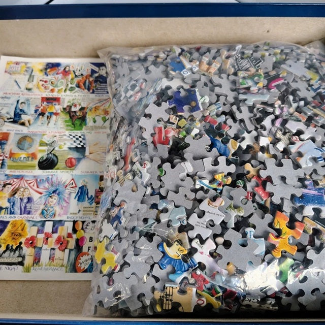 Pile of puzzle pieces with a colorful poster in the background