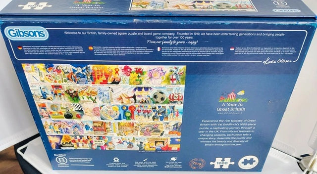 Gibsons puzzle box with colorful images on a white surface