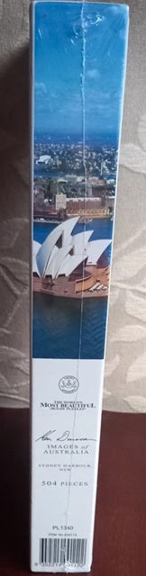 Box with a scenic design of a cityscape and a bridge, featuring the brand 'Northwest Airlines'.