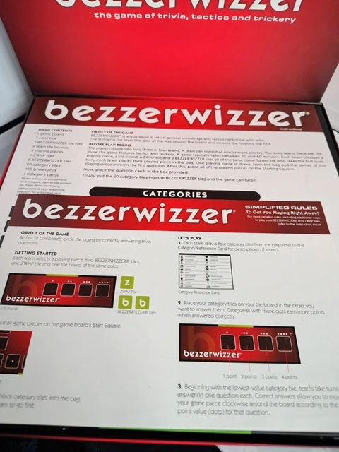 Bezerwizzer game instruction card and red game box lid, showing the game title and category rules.