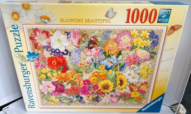 Colourful collage of different flowers from the Ravensburger Blooming Beautiful 1000 piece jigsaw puzzle.