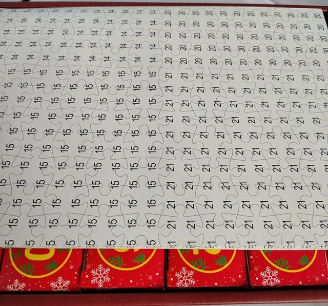 Calendar with a red border and Christmas design, featuring numbers and a pattern.