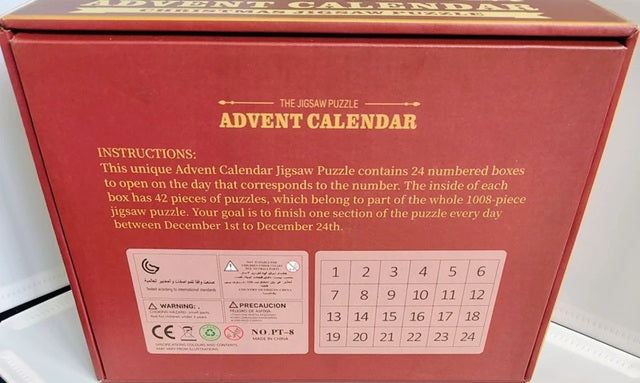 Red advent calendar box with puzzle instructions on a white background