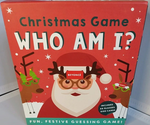 Christmas game box titled 'Who Am I?' featuring Santa Claus and reindeer on a red background.