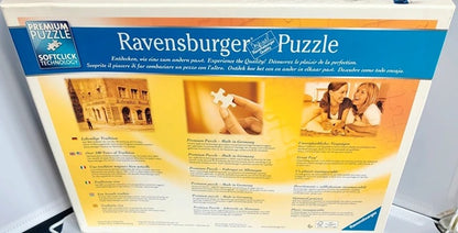 Ravensburger puzzle packaging with a couple and building illustration on a white background
