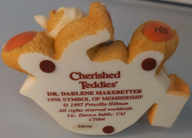 Cherished Teddies ornament with text on a gray background