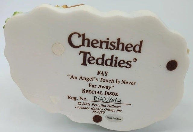 Cherished Teddies tag with product details on a white background