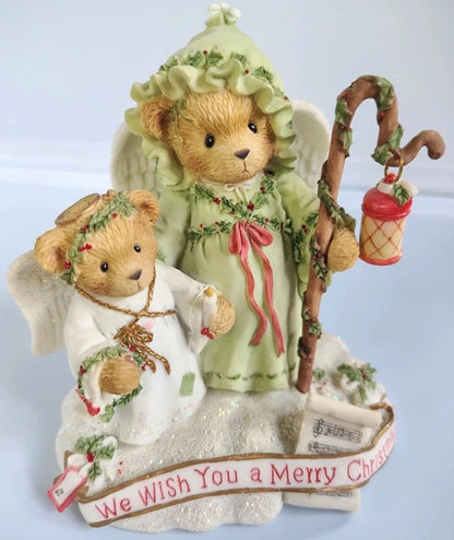 Cherished Teddies Beverly and Lila featuring Two teddy bears dressed as angels with a 'Merry Christmas' message on a light blue background.