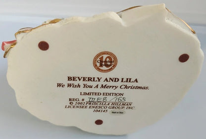 Decorative Christmas ornament with 'Beverly and Lila' text and Enesco Group Inc. branding on a white background.