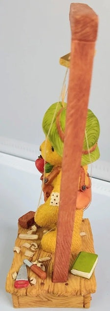 Cherished Teddies Pinocchio with a teddy bear and various small items on a white background