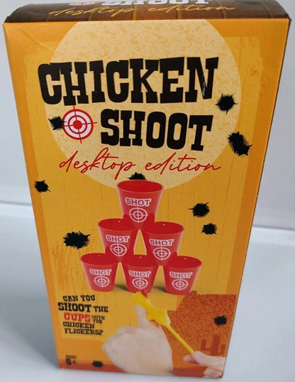 Box of 'Chicken Shoot' desktop edition game with red cups and a target on an orange background.