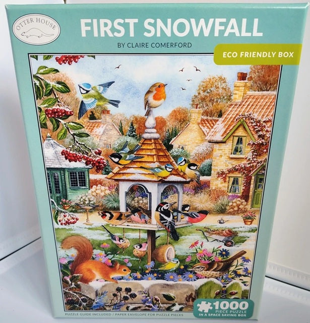 Winter birds and a red squirrel gathered around a birdhouse in a snowy village scene from a 1000 piece jigsaw puzzle.