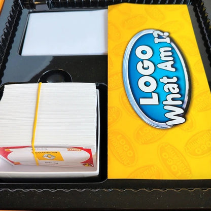 Card game packaging with cards and a yellow and blue logo on a black tray