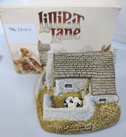 Miniature model of a cottage with 'Lilliput Lane' branding in the background. Lilliput Lane The Croft, The Scottish Collection. 1989.