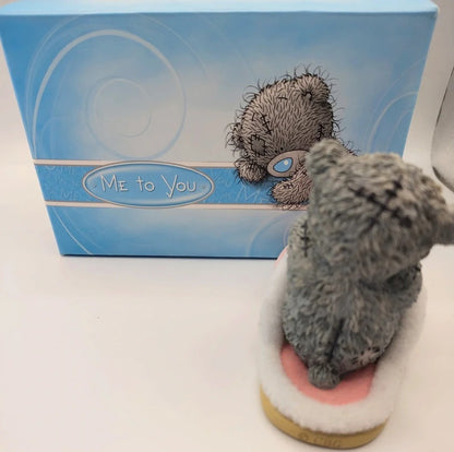 A Me to You resin figurine in a sitting pose, displayed in front of its blue branded packaging box on a white surface.