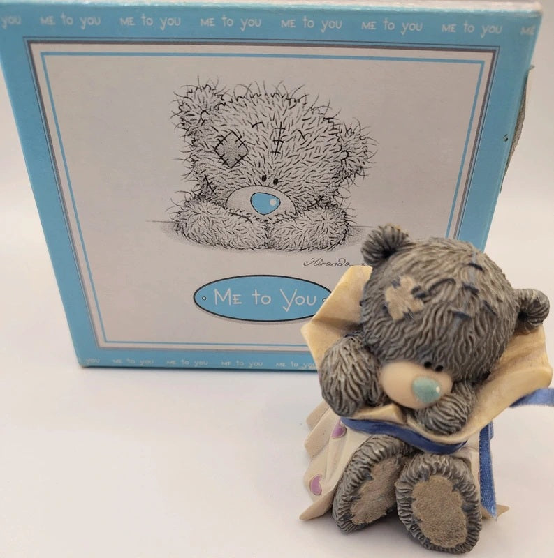 A Me to You Wrapped Just For you teddy bear figurine in front of its original light blue packaging box, featuring a black line art illustration of the bear with a blue nose on the box.