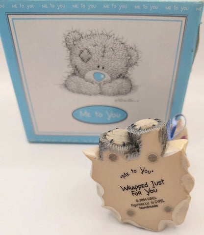 A Me to You 'Wrapped Just For You' teddy bear ornament in the foreground, with its original blue and white illustrated box behind it on a white background.