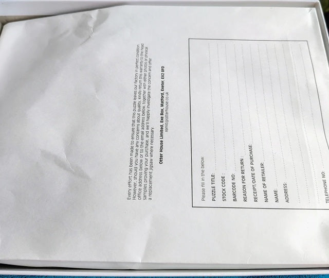 Close-up of a document inside a white box with text on it.