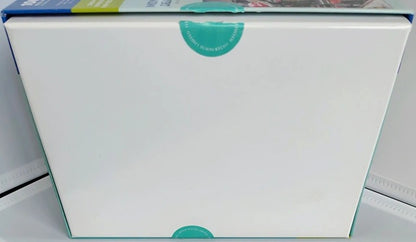 White box with a green label on a gray surface