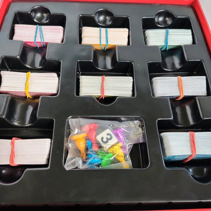 Card organizer with compartments holding cards and small items.