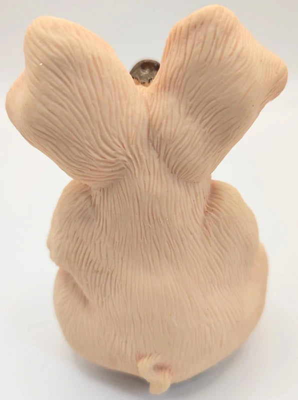 A beige Piggin Gorgeous ornament with textured fur-like detailing, photographed against a plain white background.