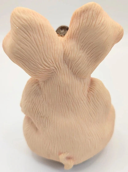 A beige Piggin Gorgeous ornament with textured fur-like detailing, photographed against a plain white background.