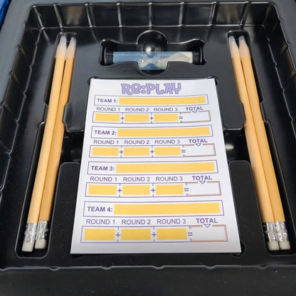 Scorecard with pencils on a black tray, featuring the 'Re:Play' brand.