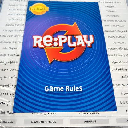 Re:Play game rules book with blue cover and red logo on a printed paper background