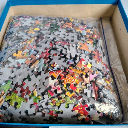 Jigsaw puzzle pieces in a box with colorful puzzle pieces.