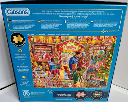 Gibsons puzzle box with a colorful illustration of a Christmas market scene on a blue background.
