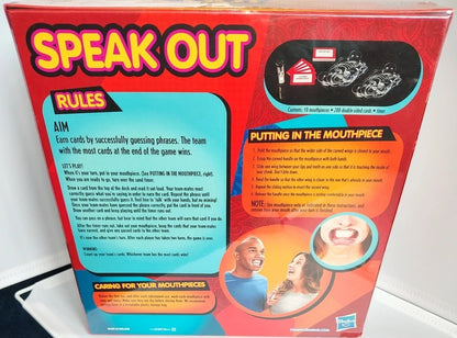 The back of the Speak Out card game box, showing the rules, playing area, and instruction panel on a red background with a blue rules section and photos of players.