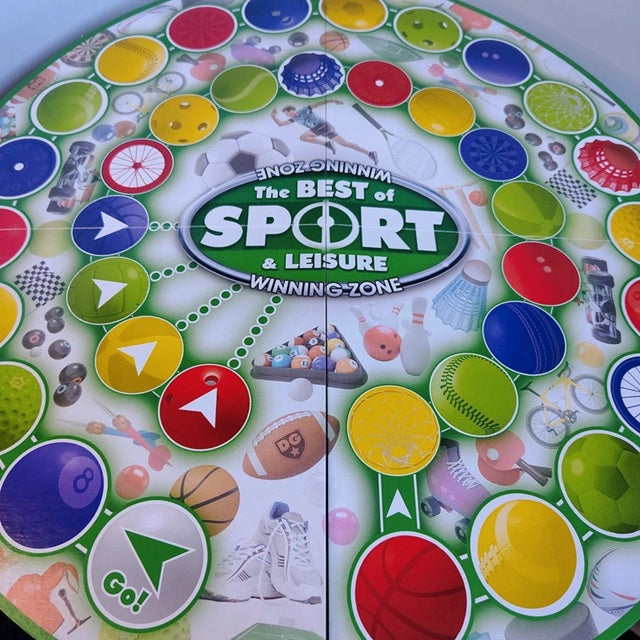 Colorful board game spinner with sports-themed graphics and 'The Best of Sport & Leisure' branding.