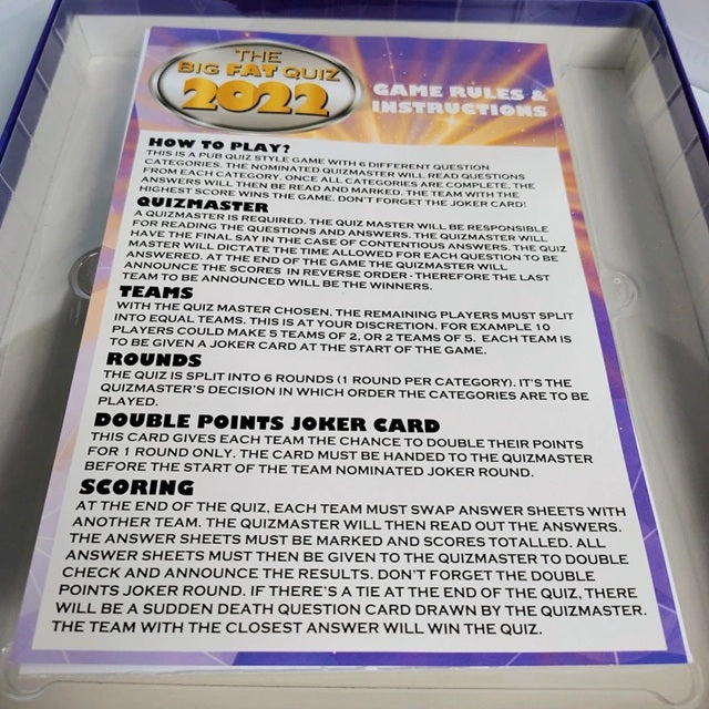 Game rules and instructions for 'The Big Fat Quiz 2022' displayed on a card.