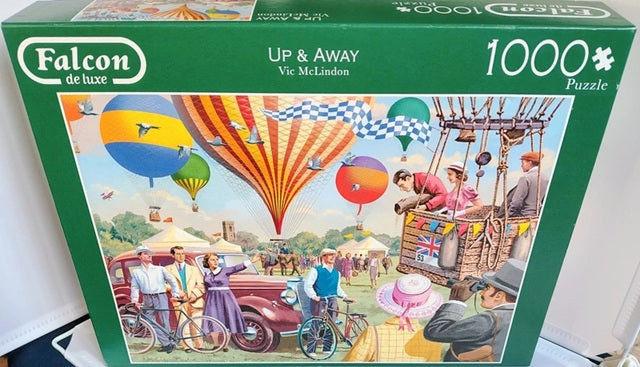 Falcon de luxe Up And Away jigsaw puzzle box with colorful illustration of hot air balloons and people.