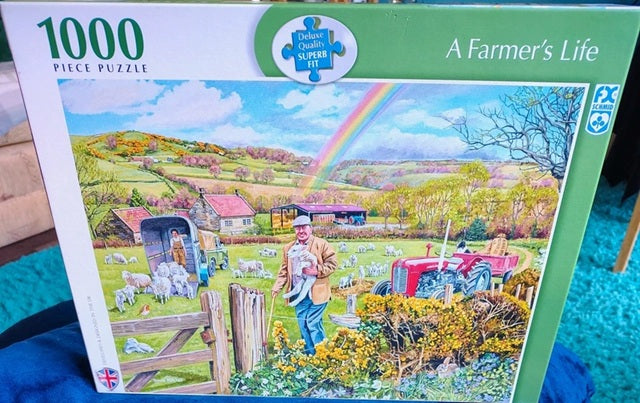 Jigsaw puzzle box titled 'A Farmer's Life' with a colorful farm scene illustration.