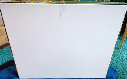 White sheet of paper on a table with a colorful background