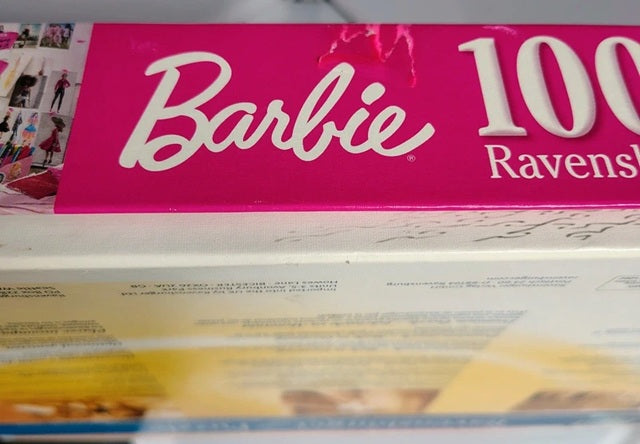 Barbie 100th Anniversary box with pink and white design
