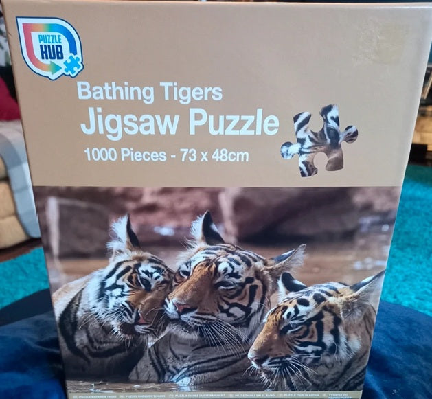 Jigsaw puzzle box featuring tigers with 'Puzzle Hub' branding.