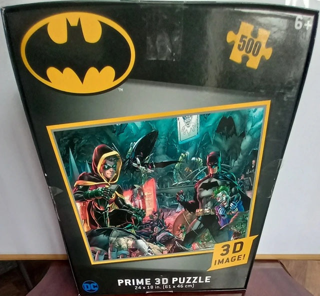 Batman-themed 3D puzzle packaging with visible Batman logo and image of puzzle pieces.
