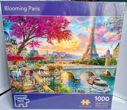 Jigsaw puzzle box featuring the Eiffel Tower and cherry blossoms in Paris