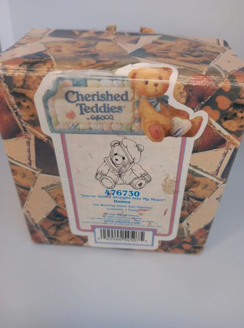 Box of Cherished Teddies with teddy bear design on a white background