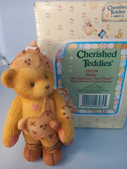 Cherished Teddies teddy bear with packaging on a light blue background